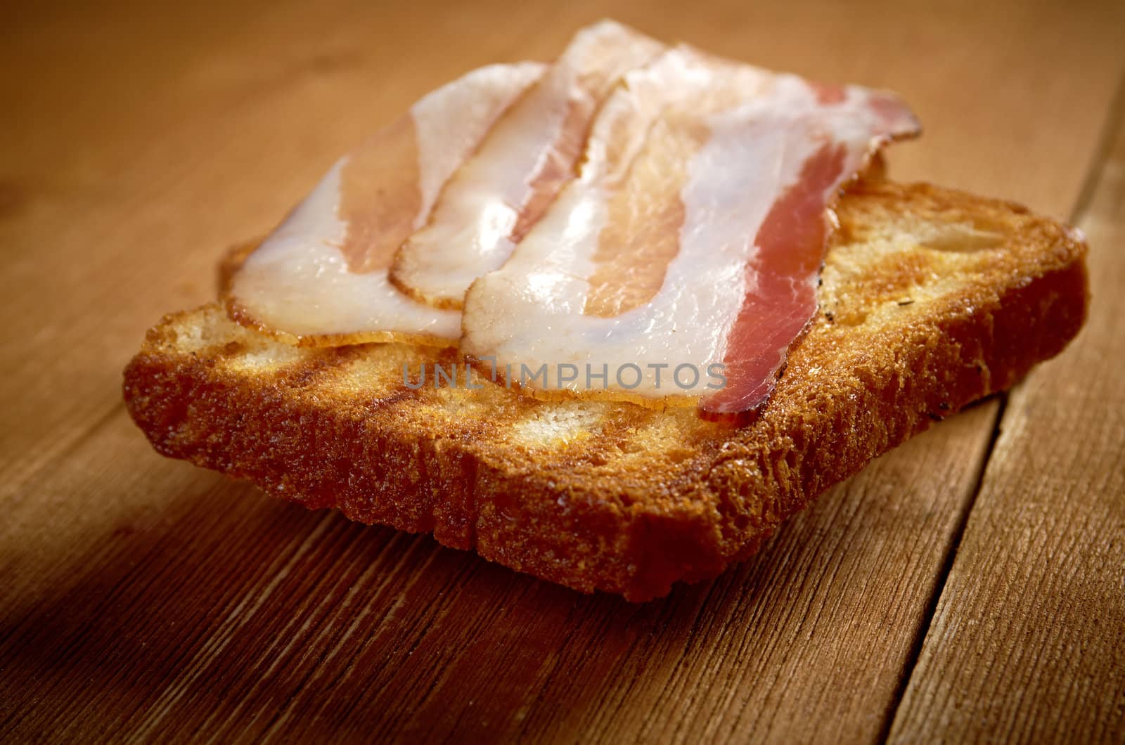 pile  toasted bread slices for bacon.Close up of toasted white bread in slices