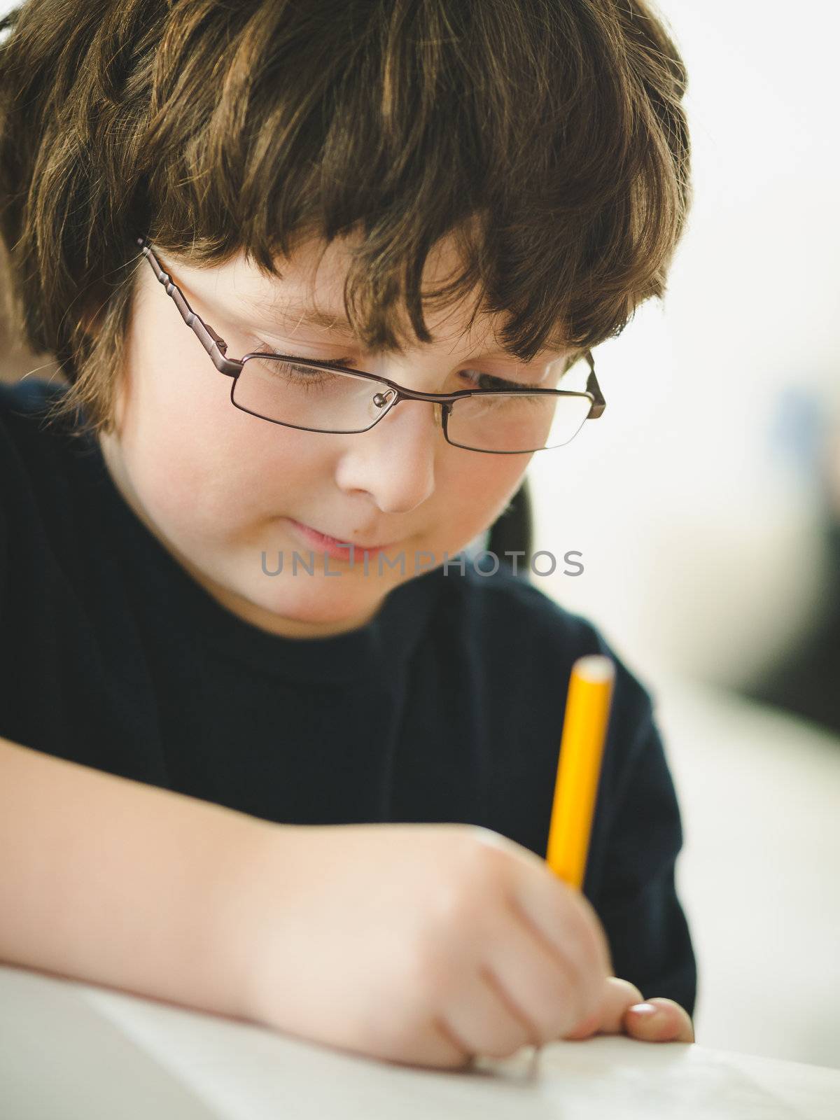 boy doing his homework by Talanis