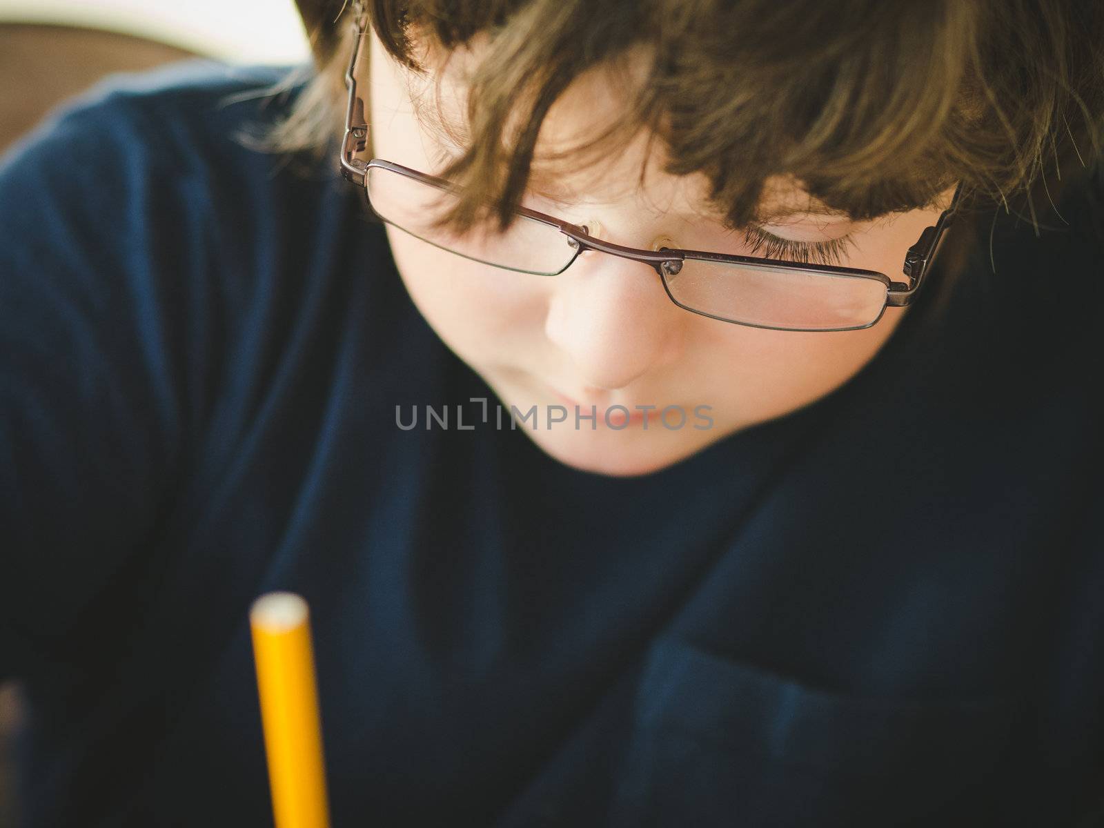 boy doing his homework by Talanis