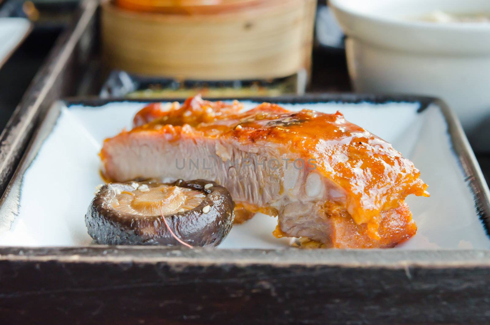 Chinese spare ribs with mushroom on plate