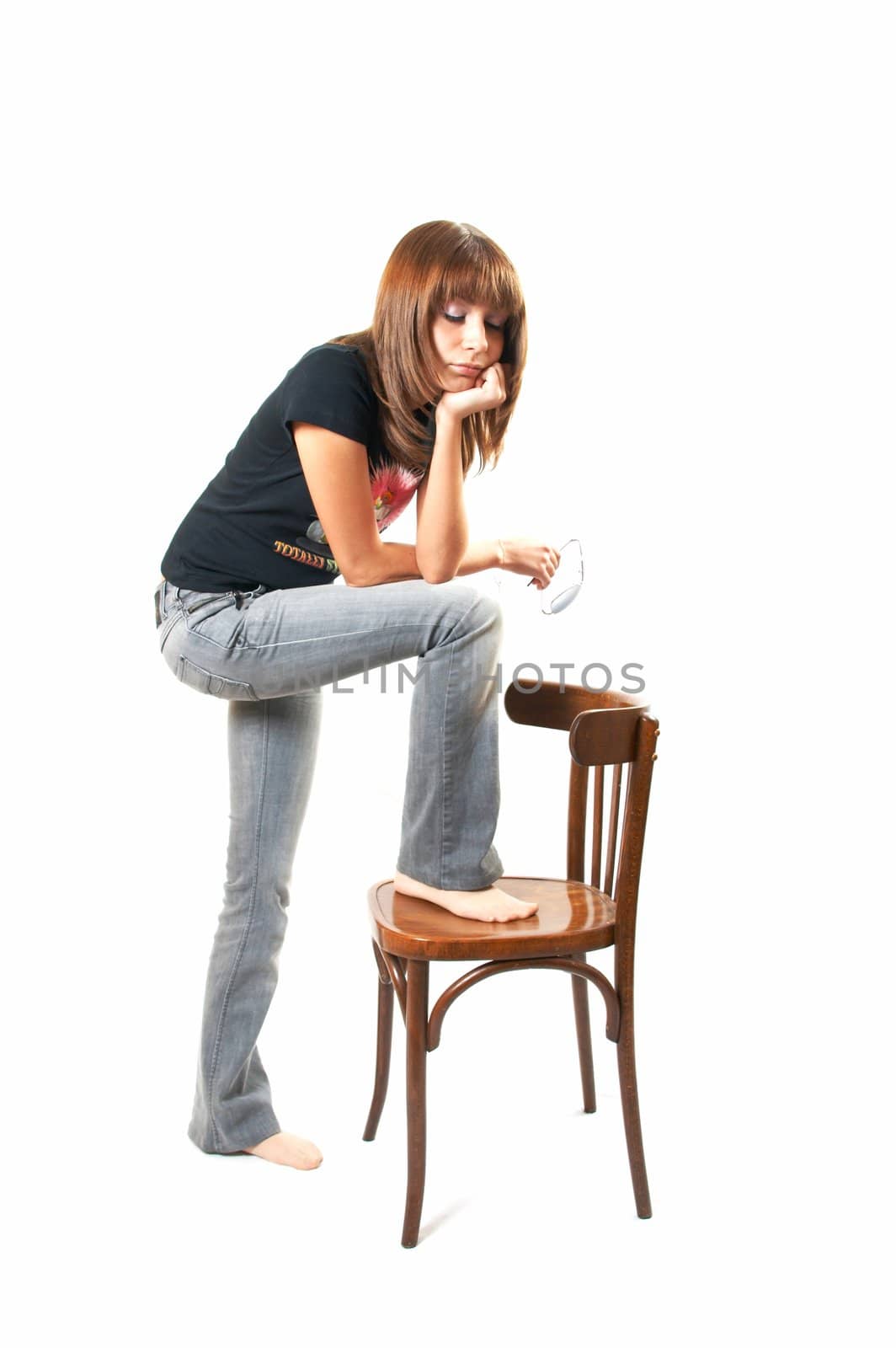 The girl with a chair on a white background 