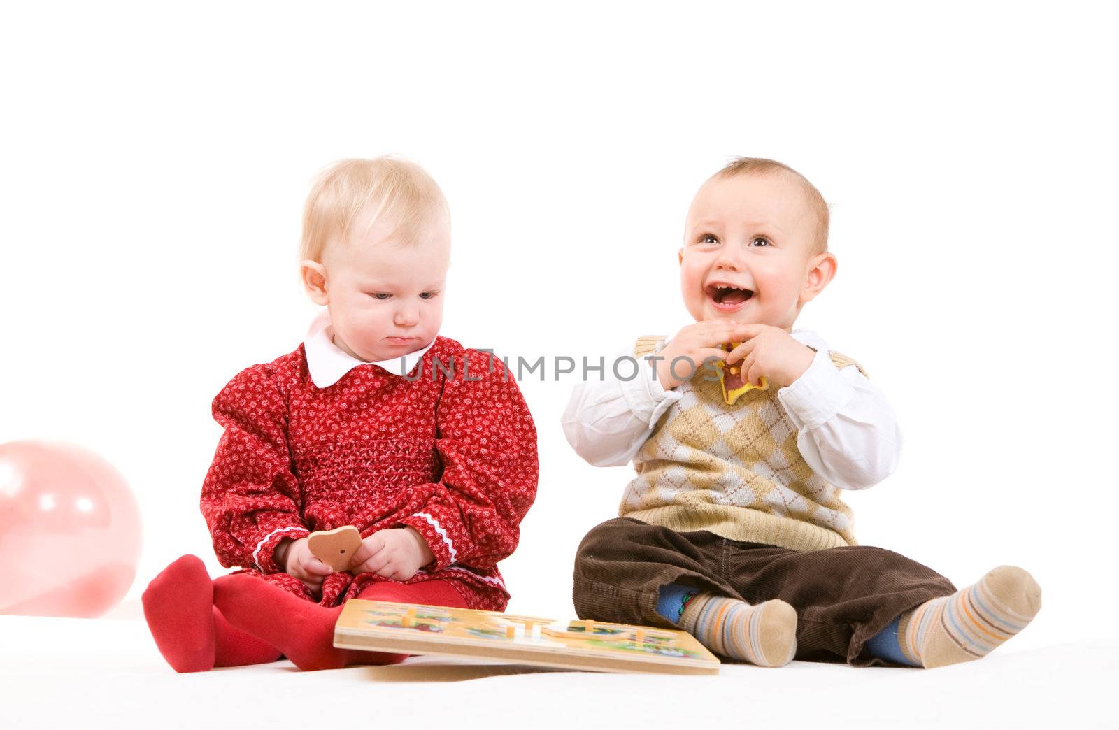 boy of one year old tries to inflate a balloon