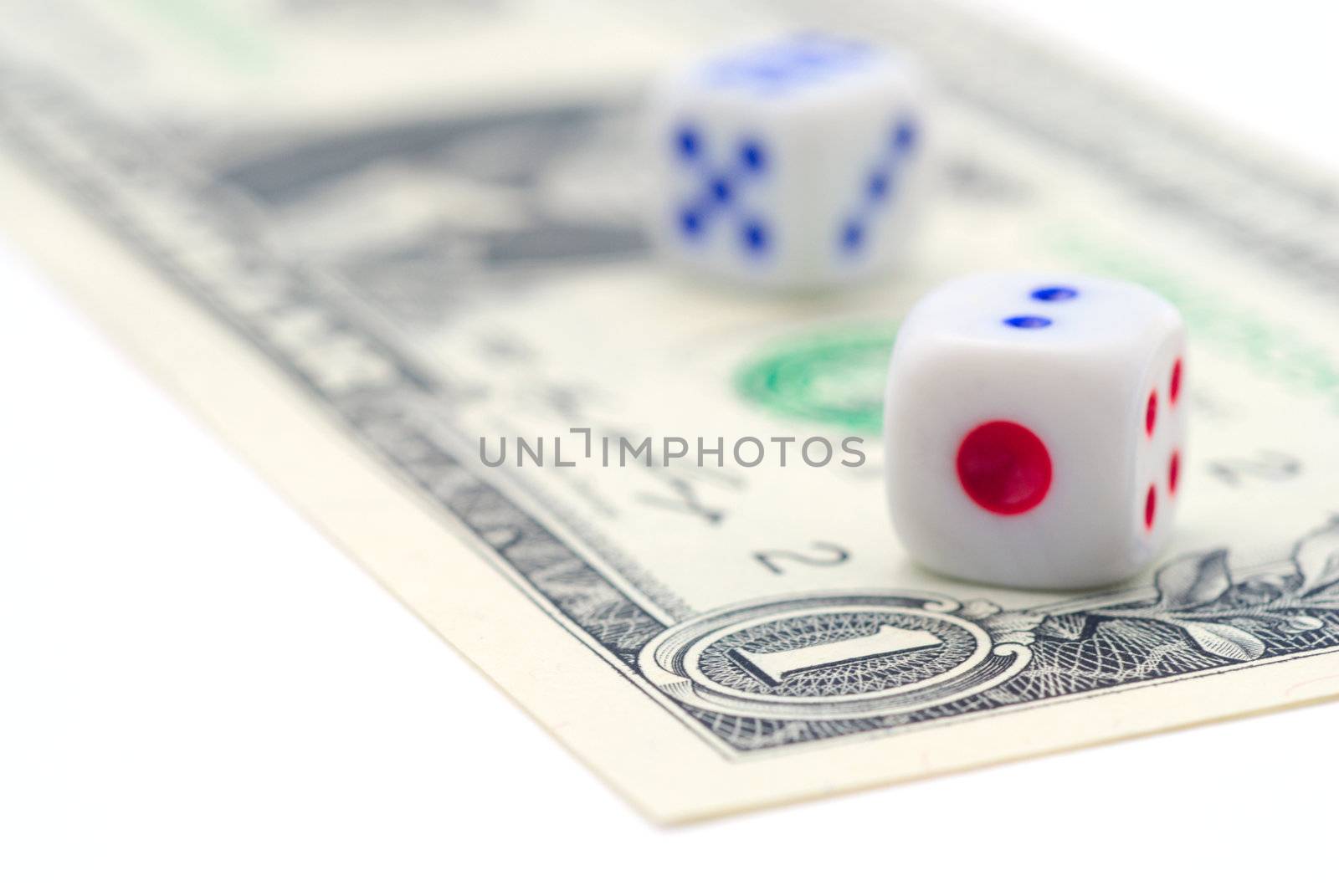 Two dice are on banknotes