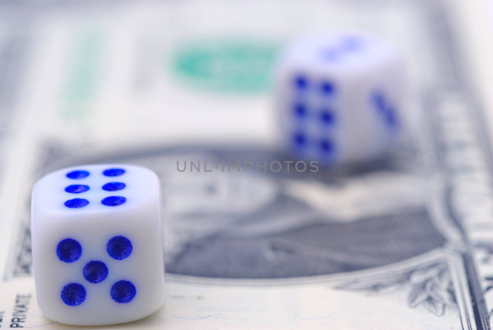 Two dice and banknote