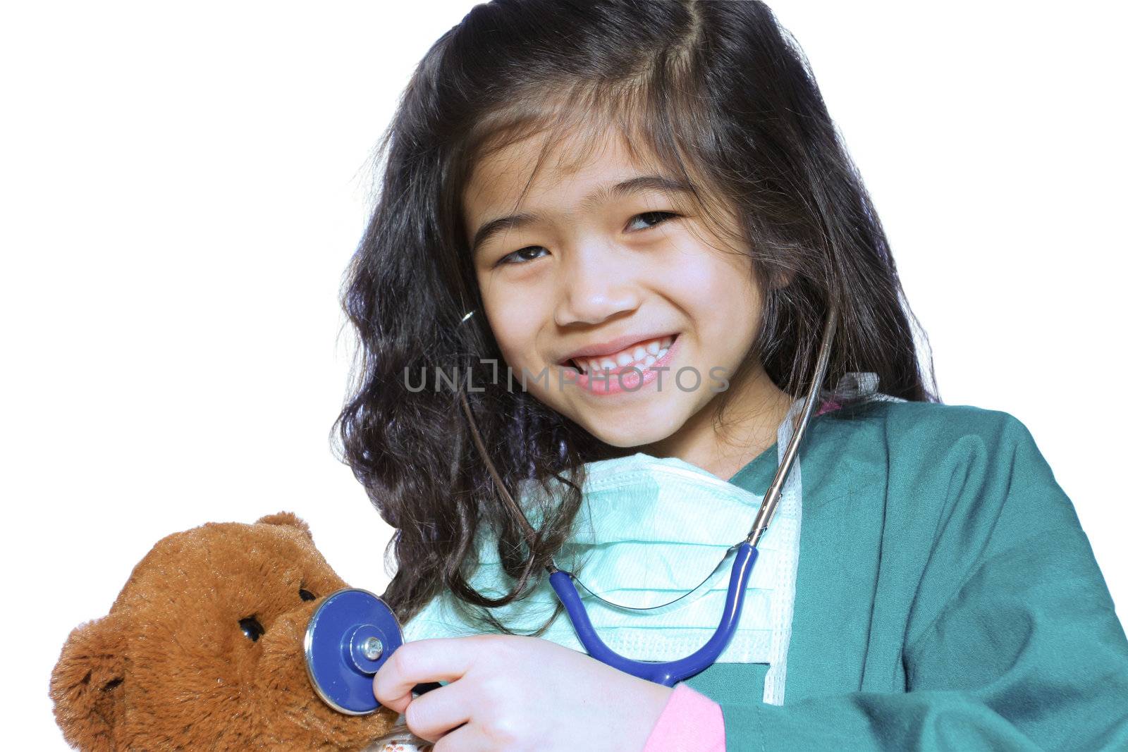 Six year old girl playing doctor