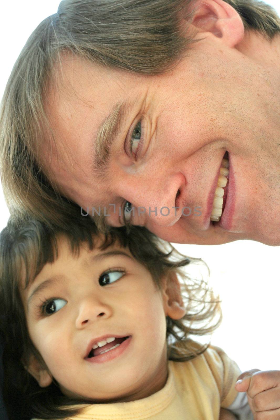 Loving father face to face with his toddler son.