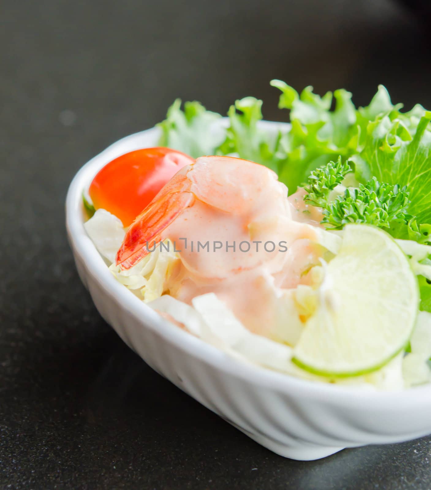 close up vegetable  salad with  prawn , mix vegetable and white cream sauce , white bowl