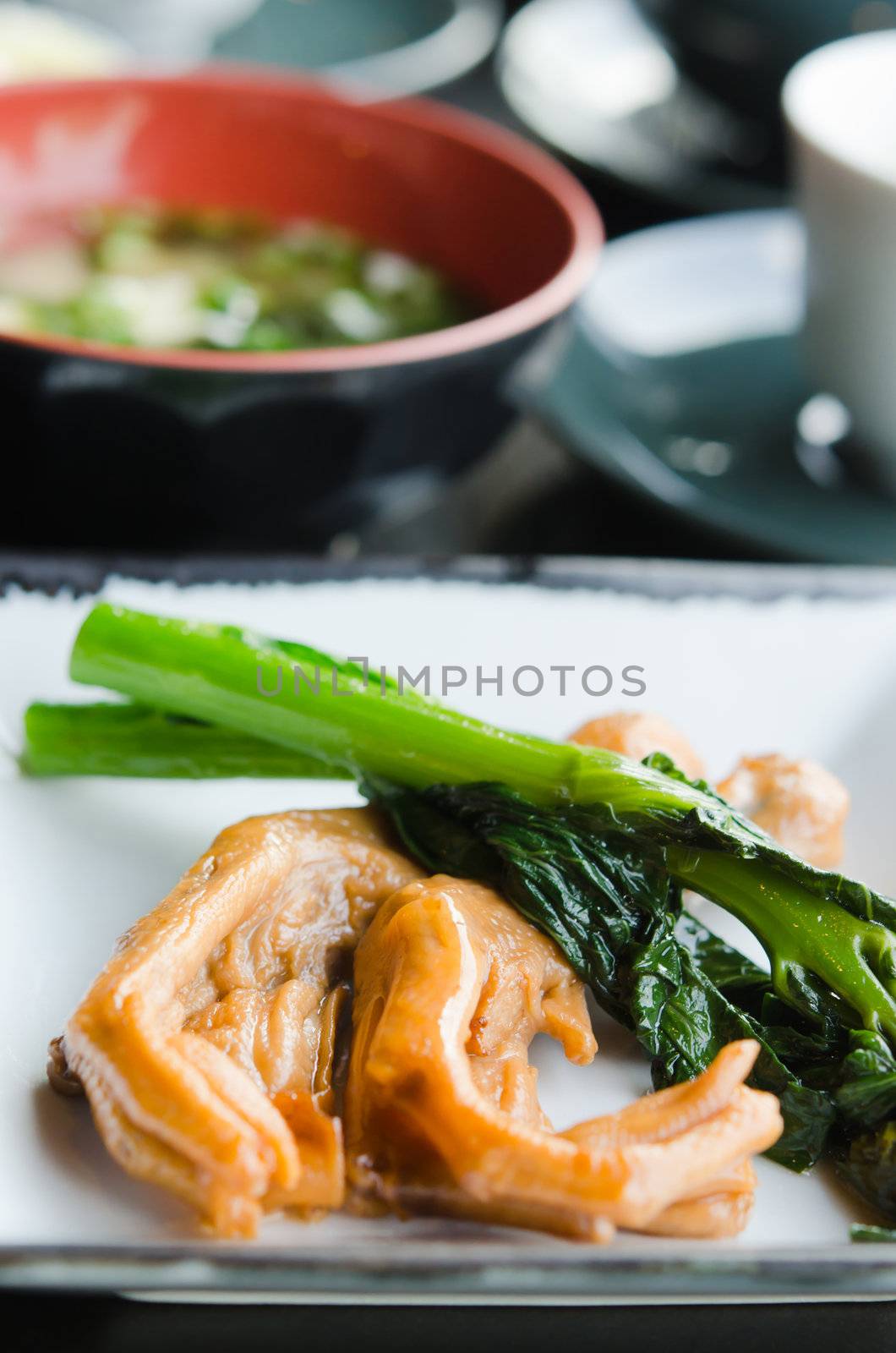 Chicken feet and vegetable on dish,  delicious Chinese food