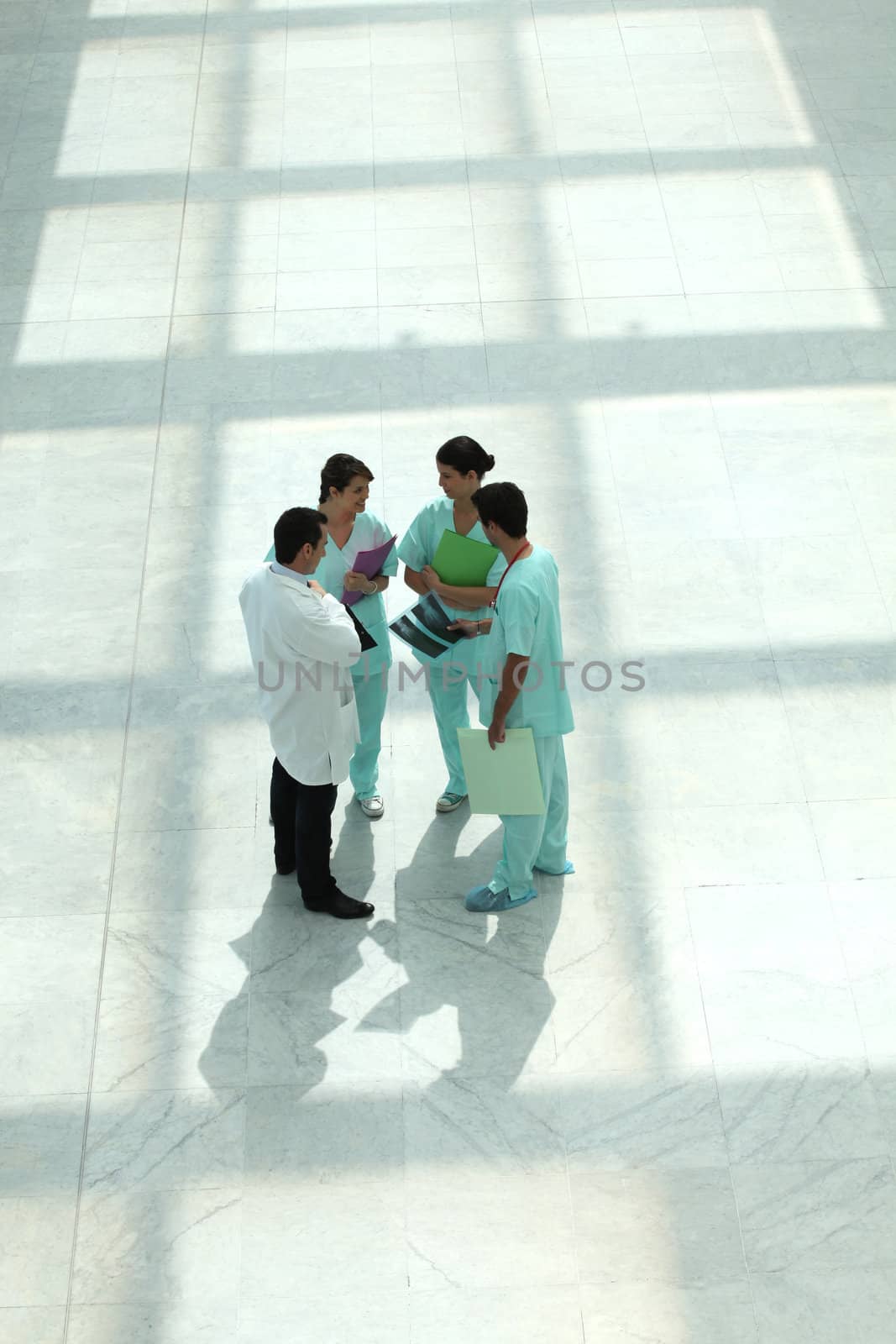 Medical team in an atrium by phovoir
