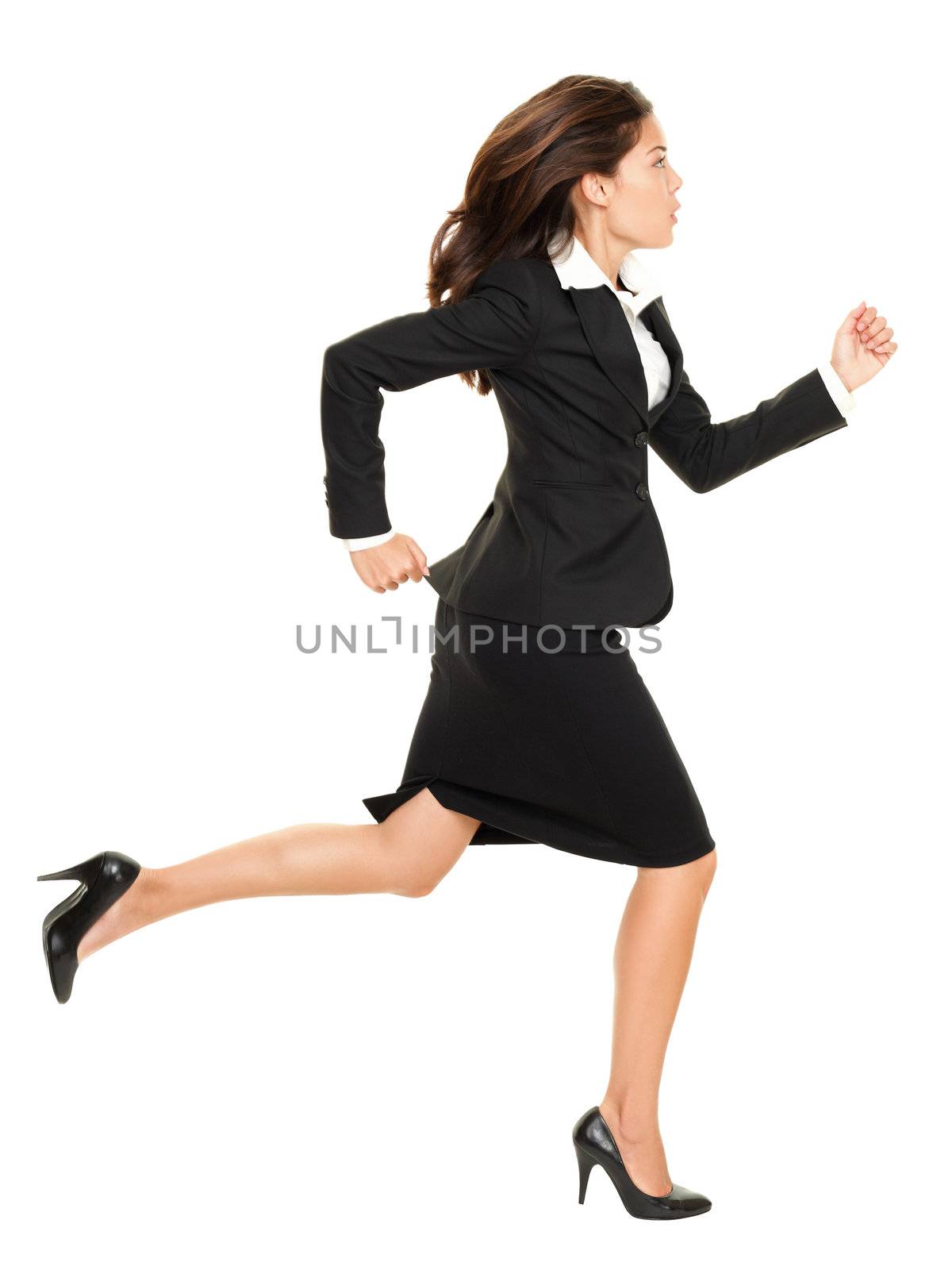 Business woman running in suit in full body isolated on white background. Business concept image with young mixed race Caucasian / Chinese Asian businesswoman.