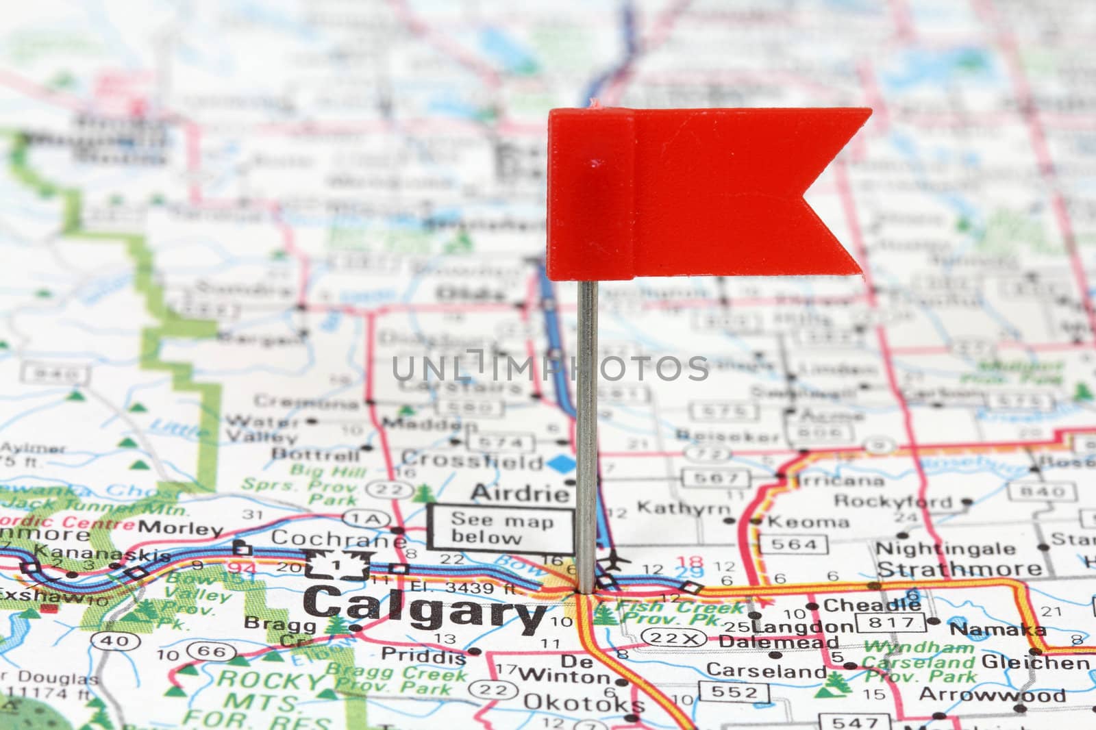 Calgary in Alberta, Canada. Red flag pin on an old map showing travel destination.