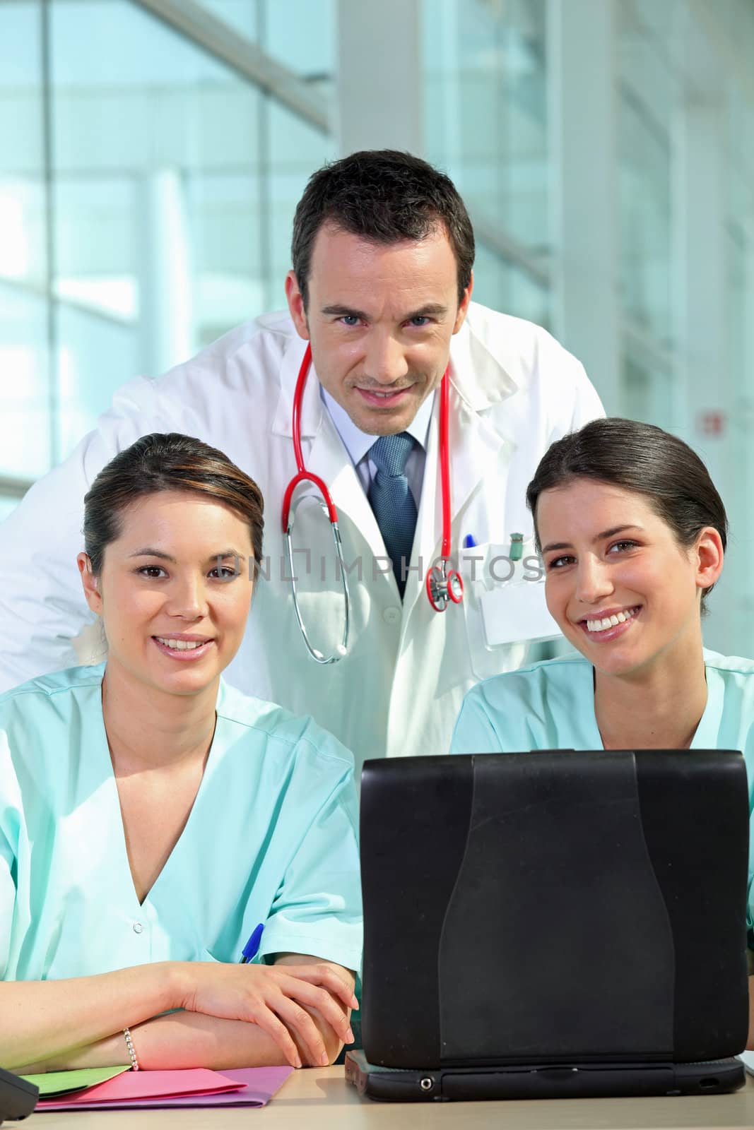 A group of medical professionals by phovoir