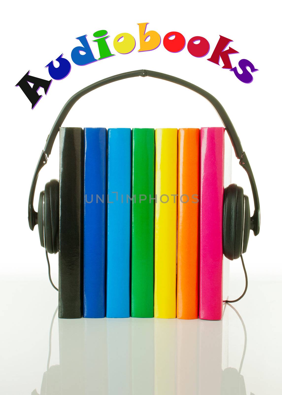 Row of books and headphones on the reflective surface over white background