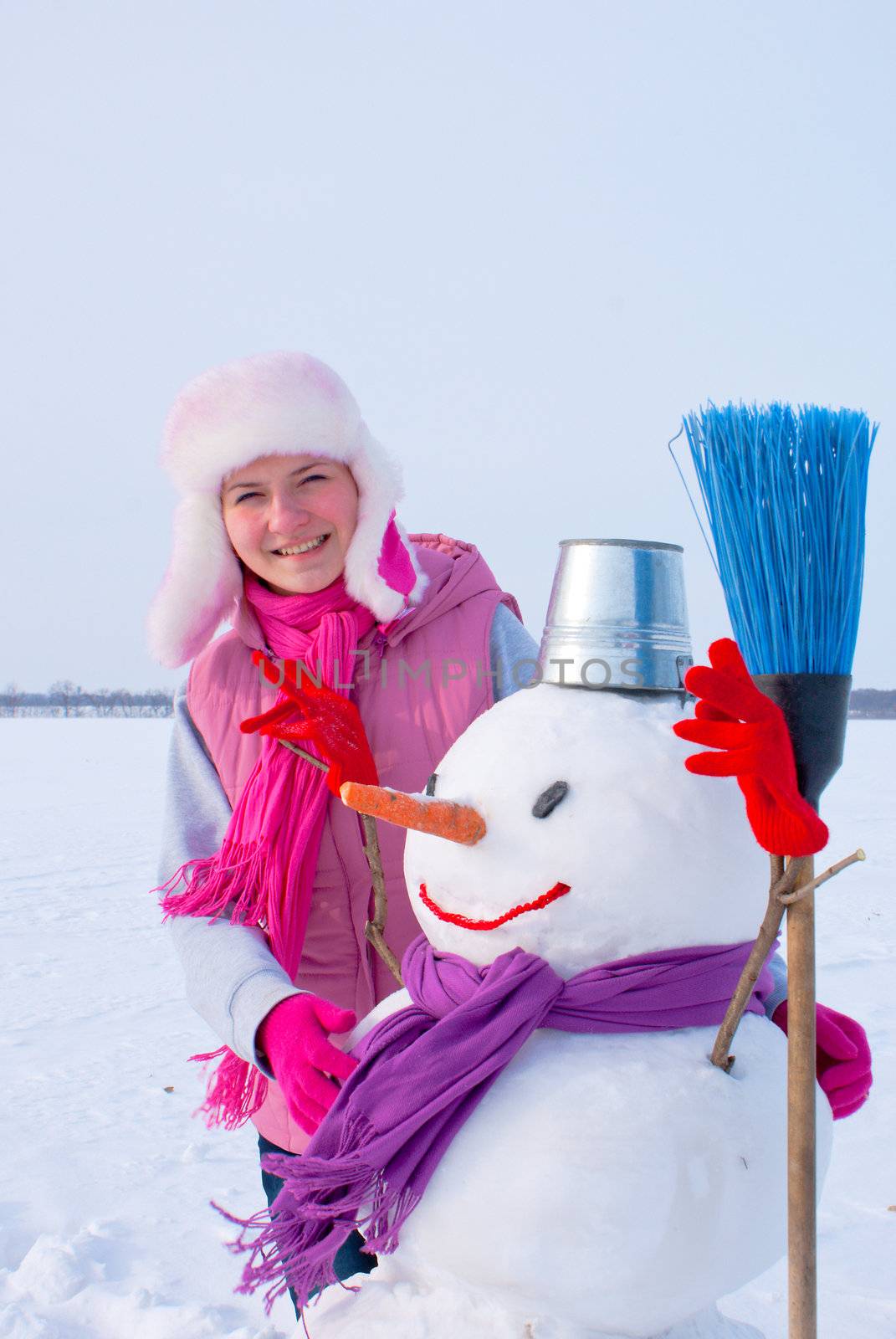 Teenage girl with snowman by AndreyKr