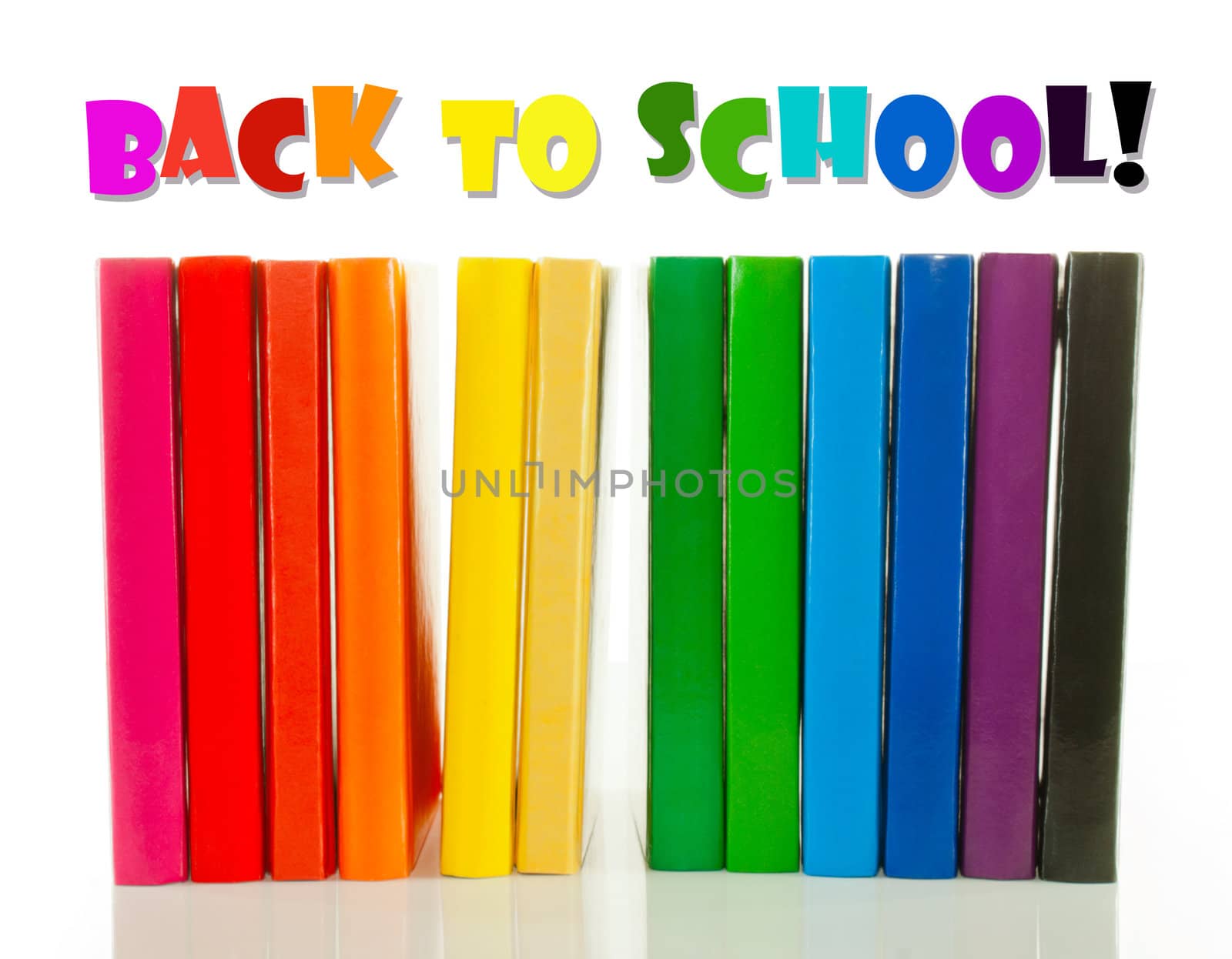 Row of colorful books over white background