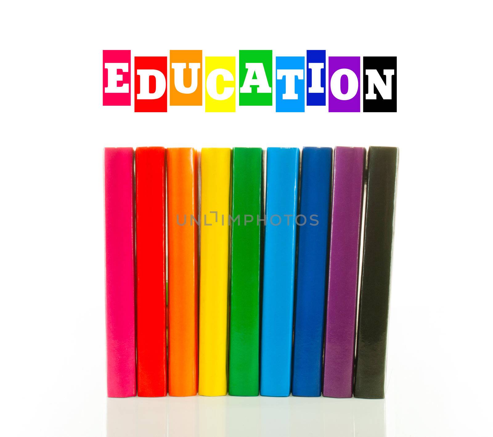 Multi color books against white background