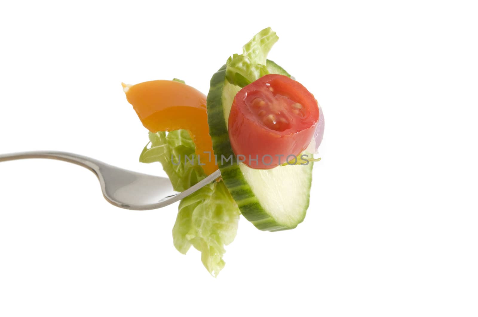 A fork full of salad including cucumber, tomatoe, pepper and lettuce, isolated on a white background