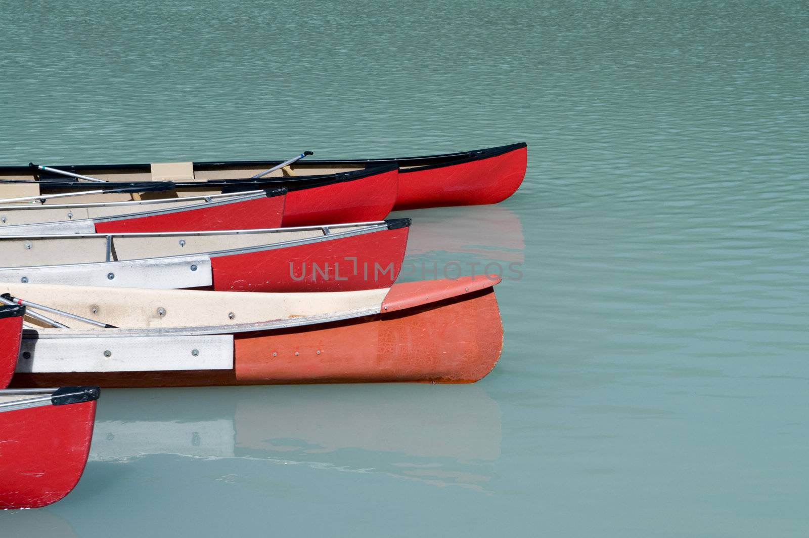 Canoes on a glacier fed lake in Banff National Park, Alberta, Canada