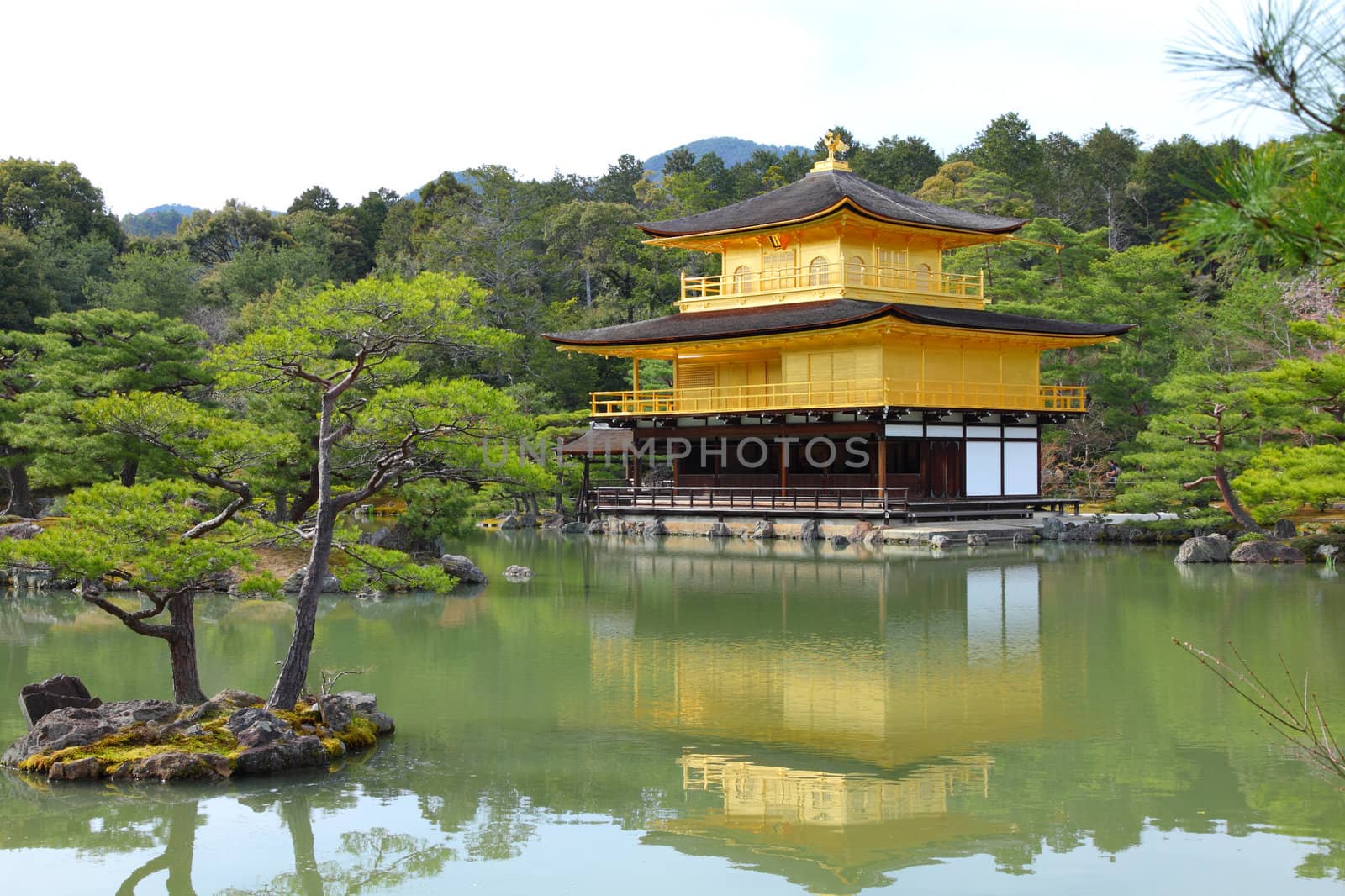 Kyoto, Japan - Golden Pavillion shariden at famous Kinkakuji (Kinkaku-ji) Temple. Buddhist zen temple of Rinzai school.