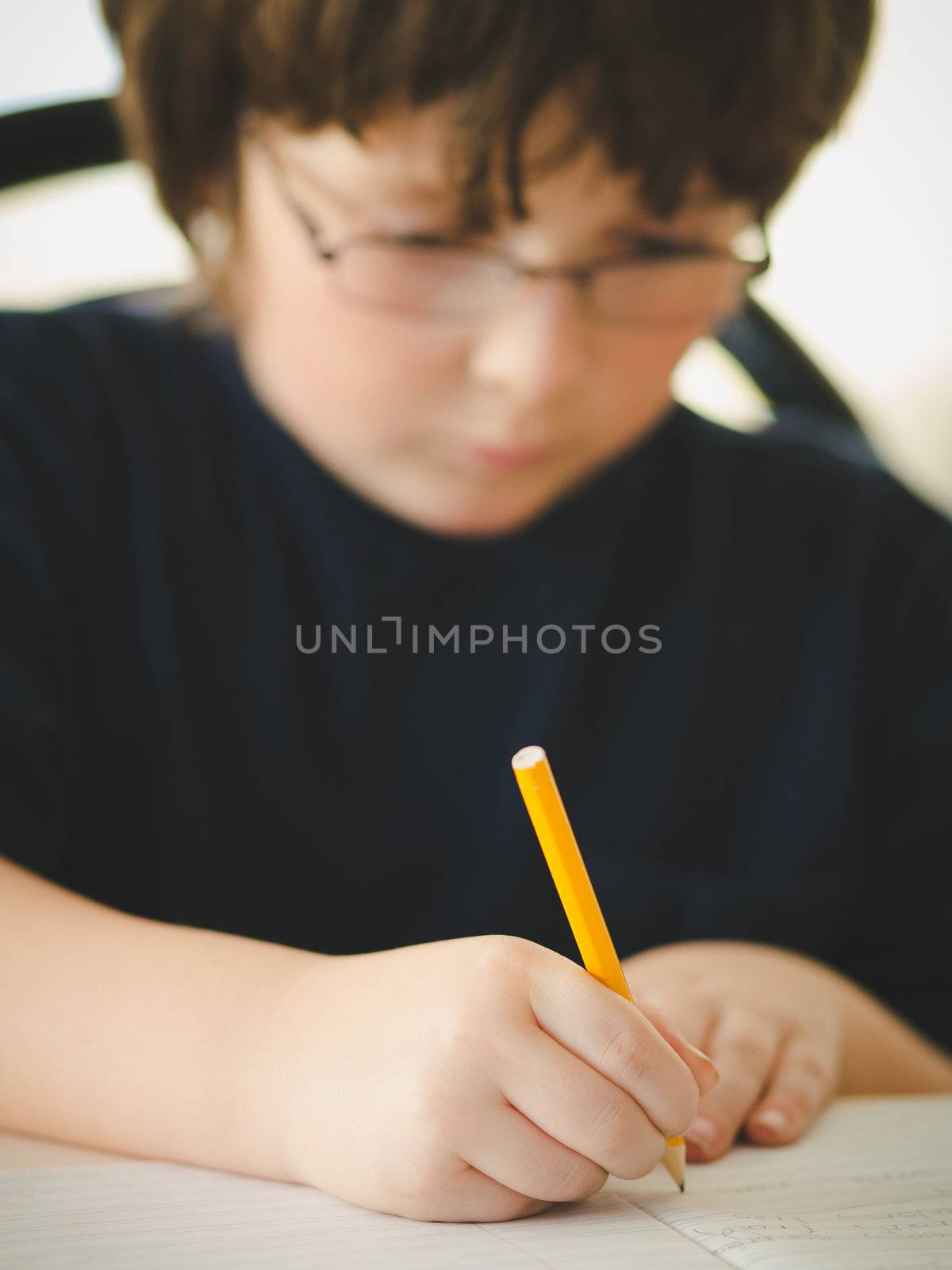 Cute little boy doing his homework