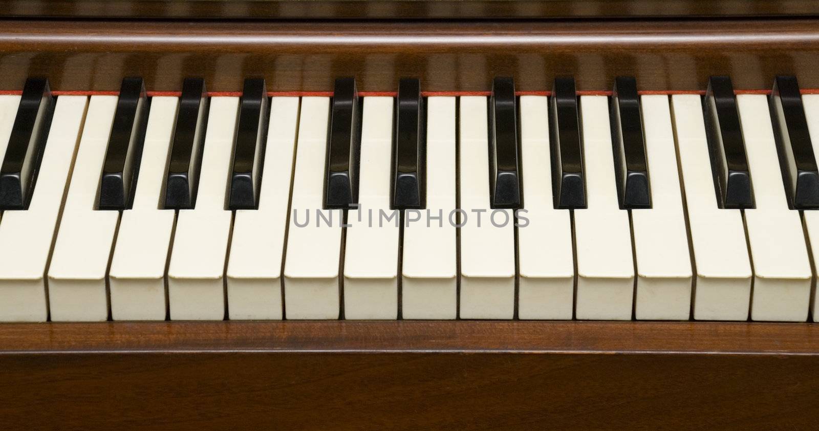 Closeup of Piano Keys on 60's instrument.