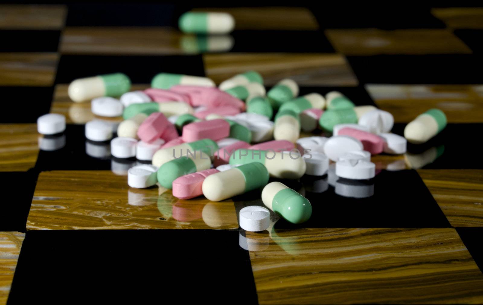 Selective focus on the foreground perscription medication on a chess board - a dangerous game