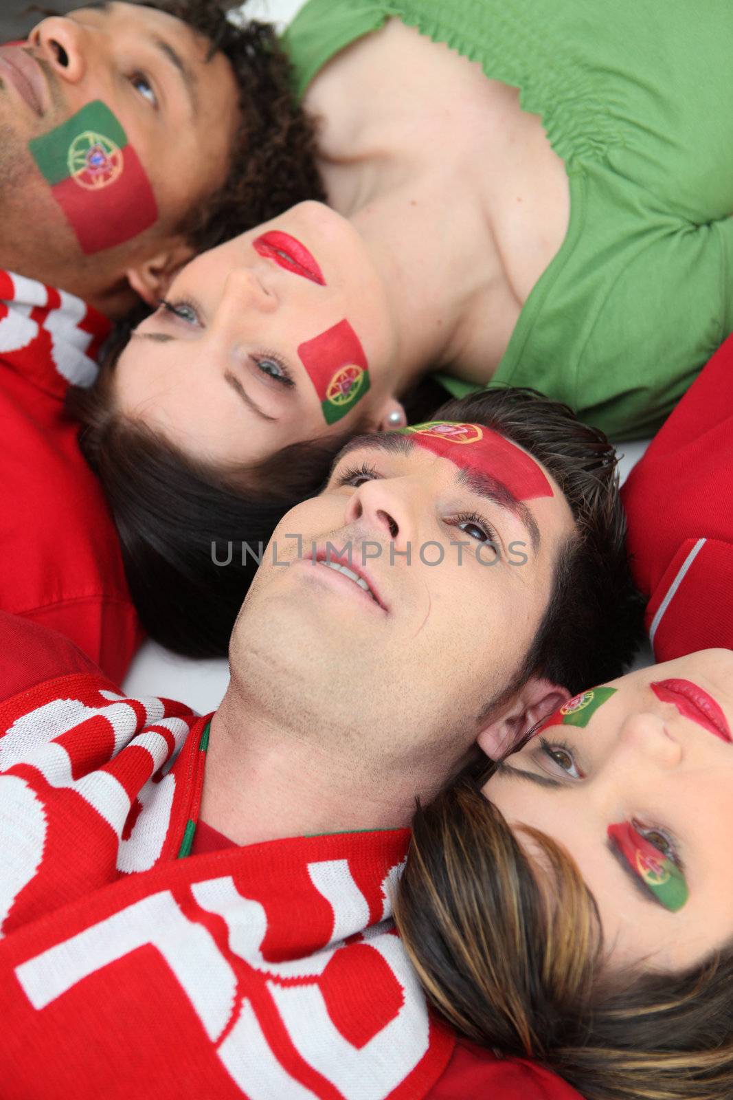 Supporters of Portugal lying on the floor