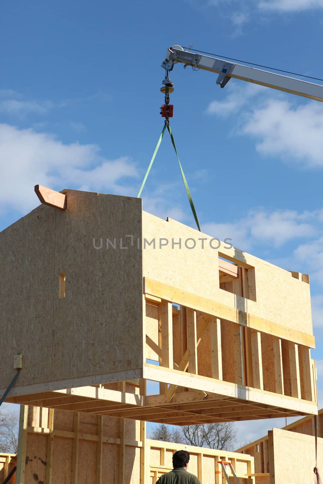 crane on a construction site by phovoir