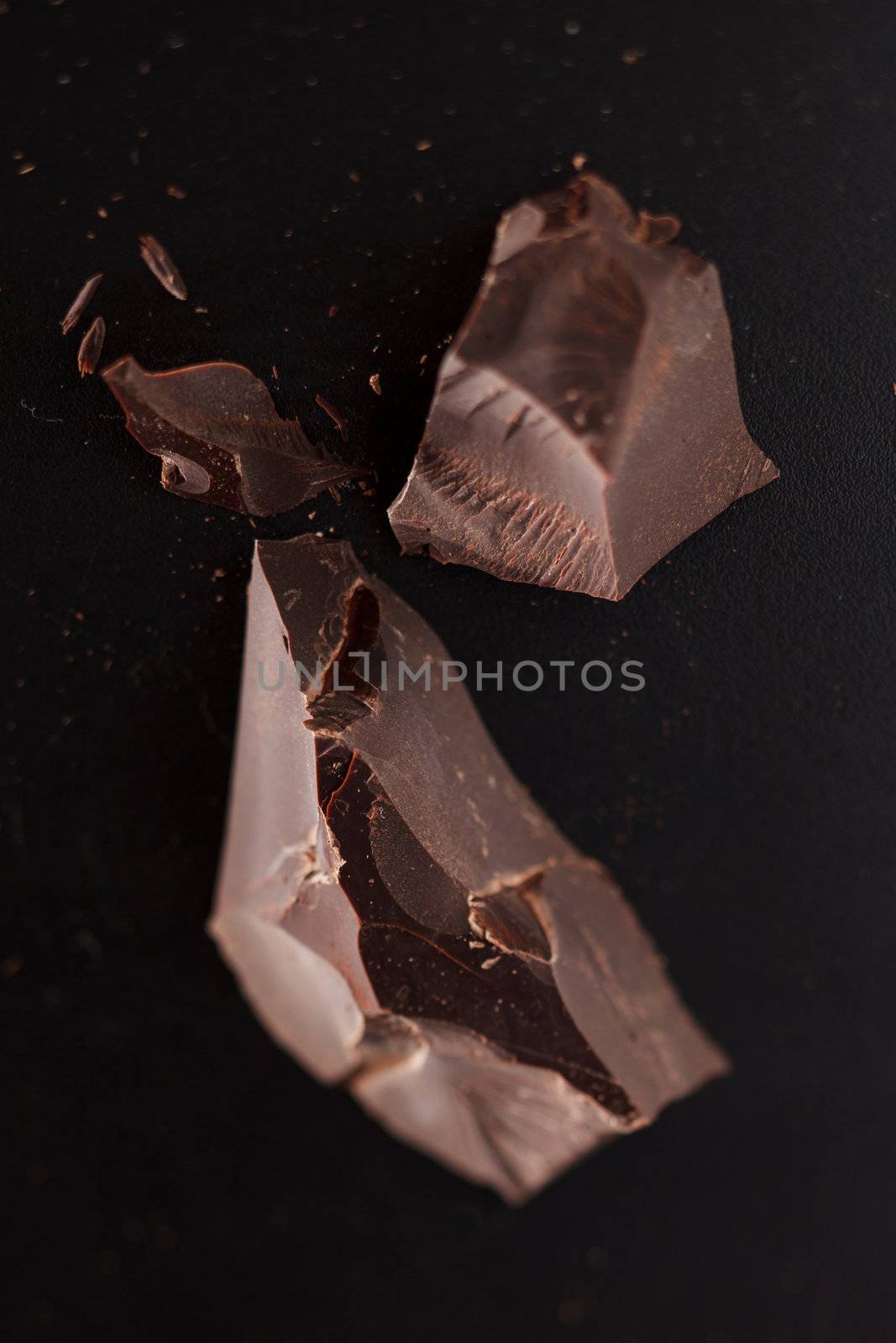 chocolate on black background by shebeko