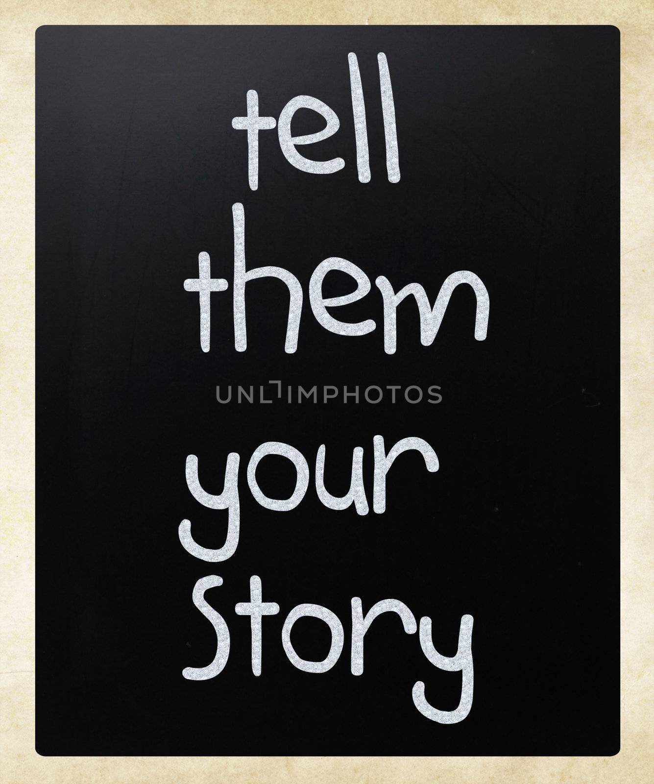 "Tell them your story" handwritten with white chalk on a blackboard