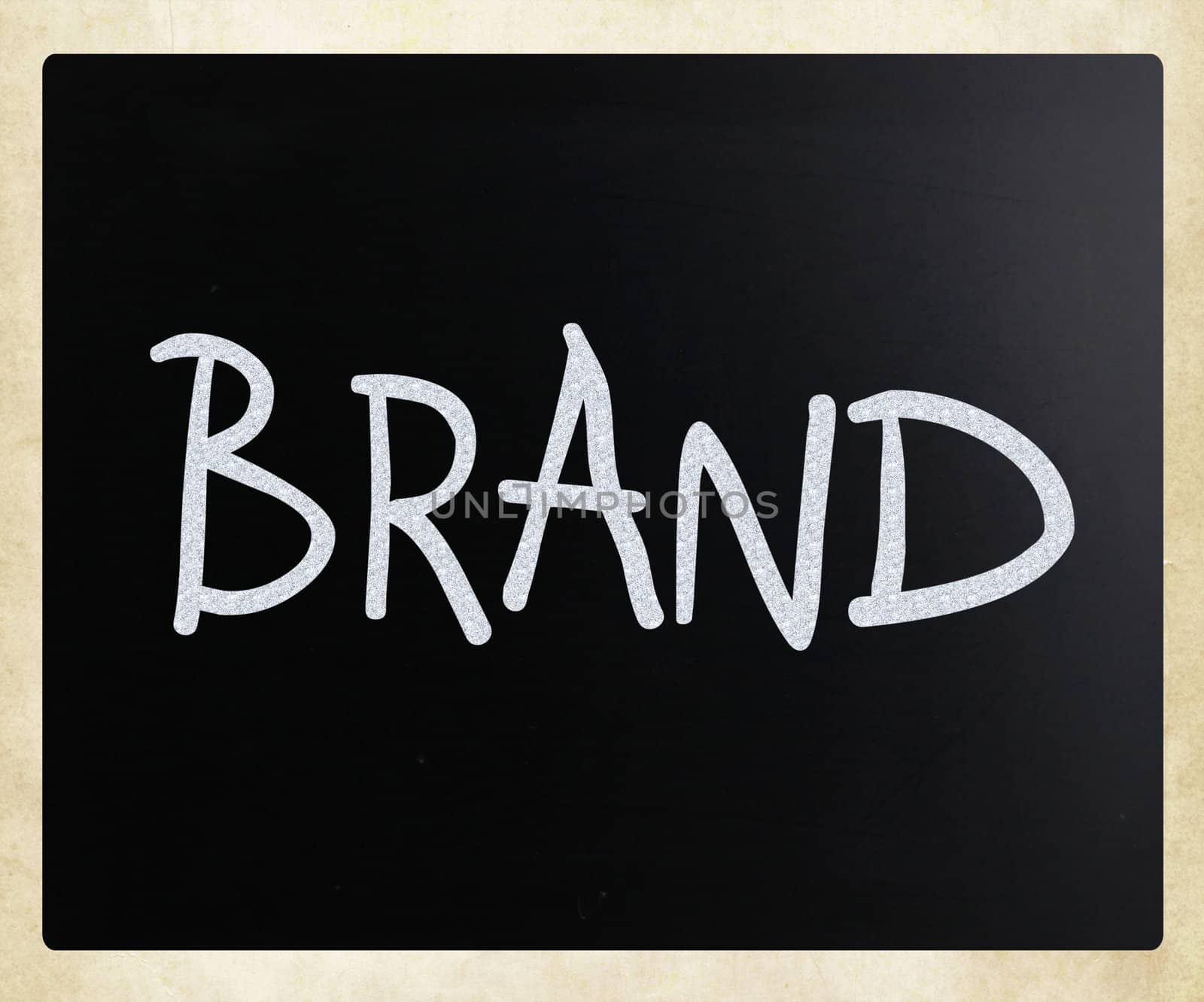 "BRAND" handwritten with white chalk on a blackboard
