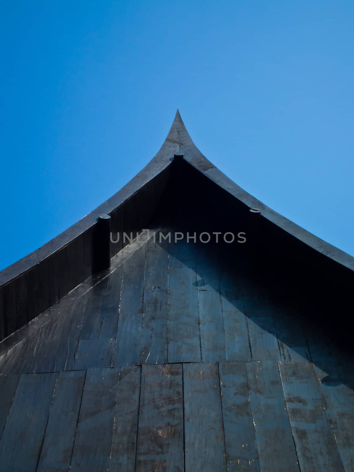 this is a thai gables home on blue sky background