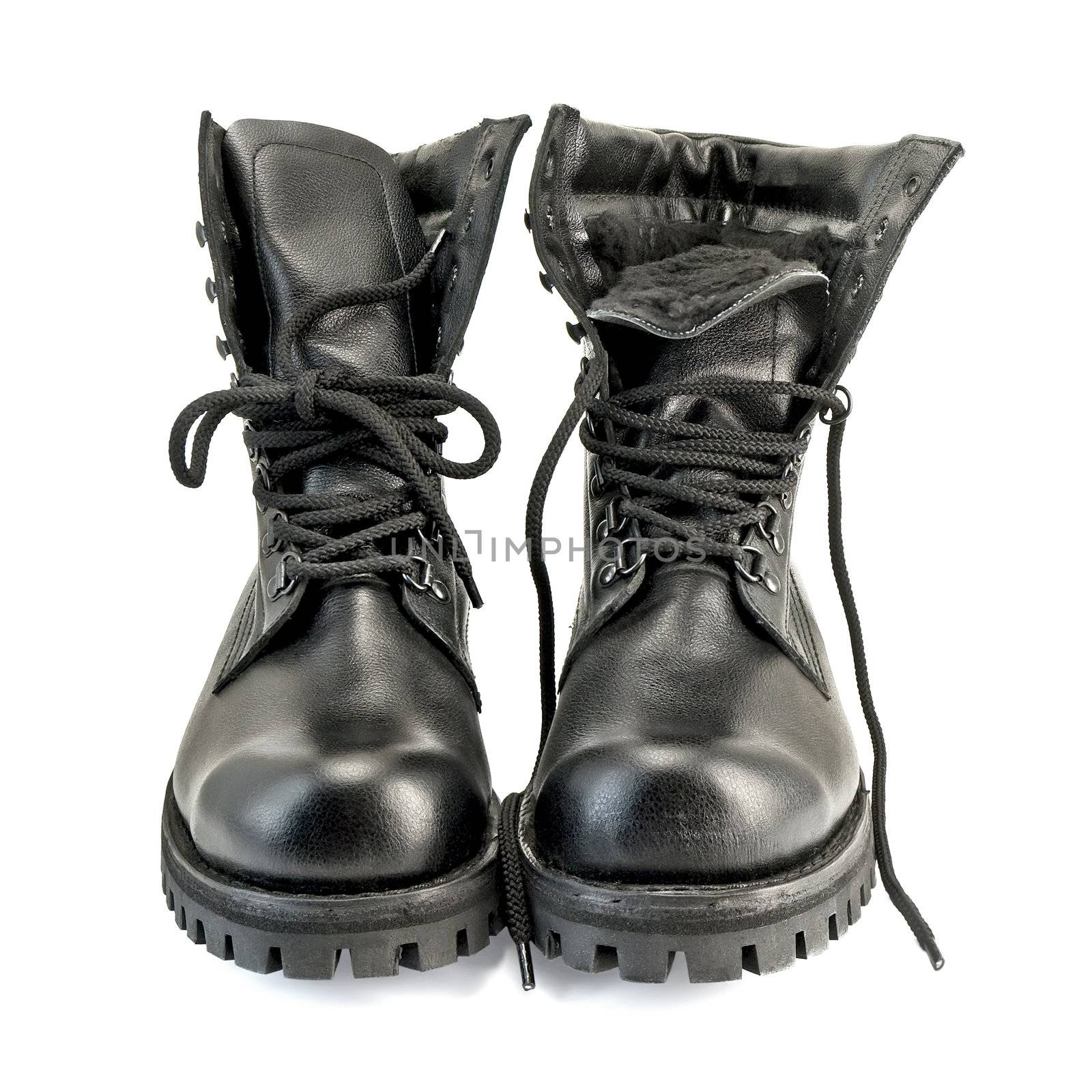 A pair of high black leather boots isolated on white background