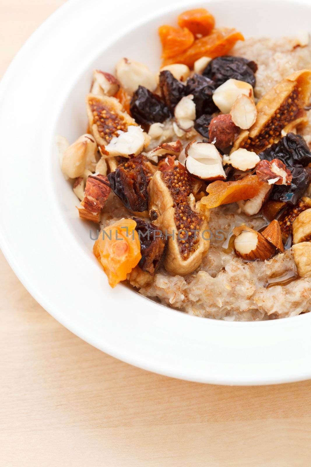 oatmeal with raisins, nuts and maple syrup by shebeko