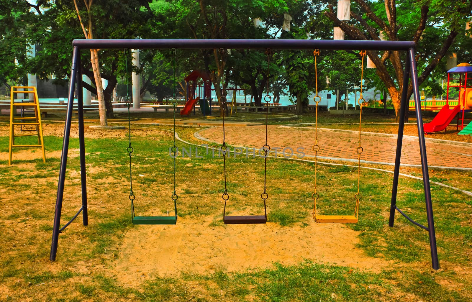 Old swing on the playground by sutipp11