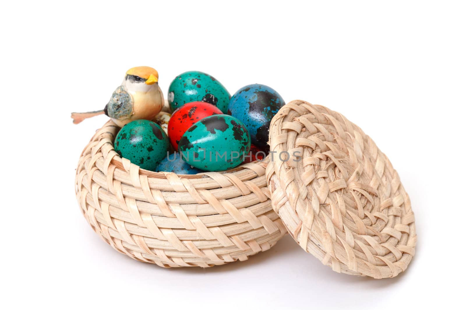 quail easter eggs in basket on white