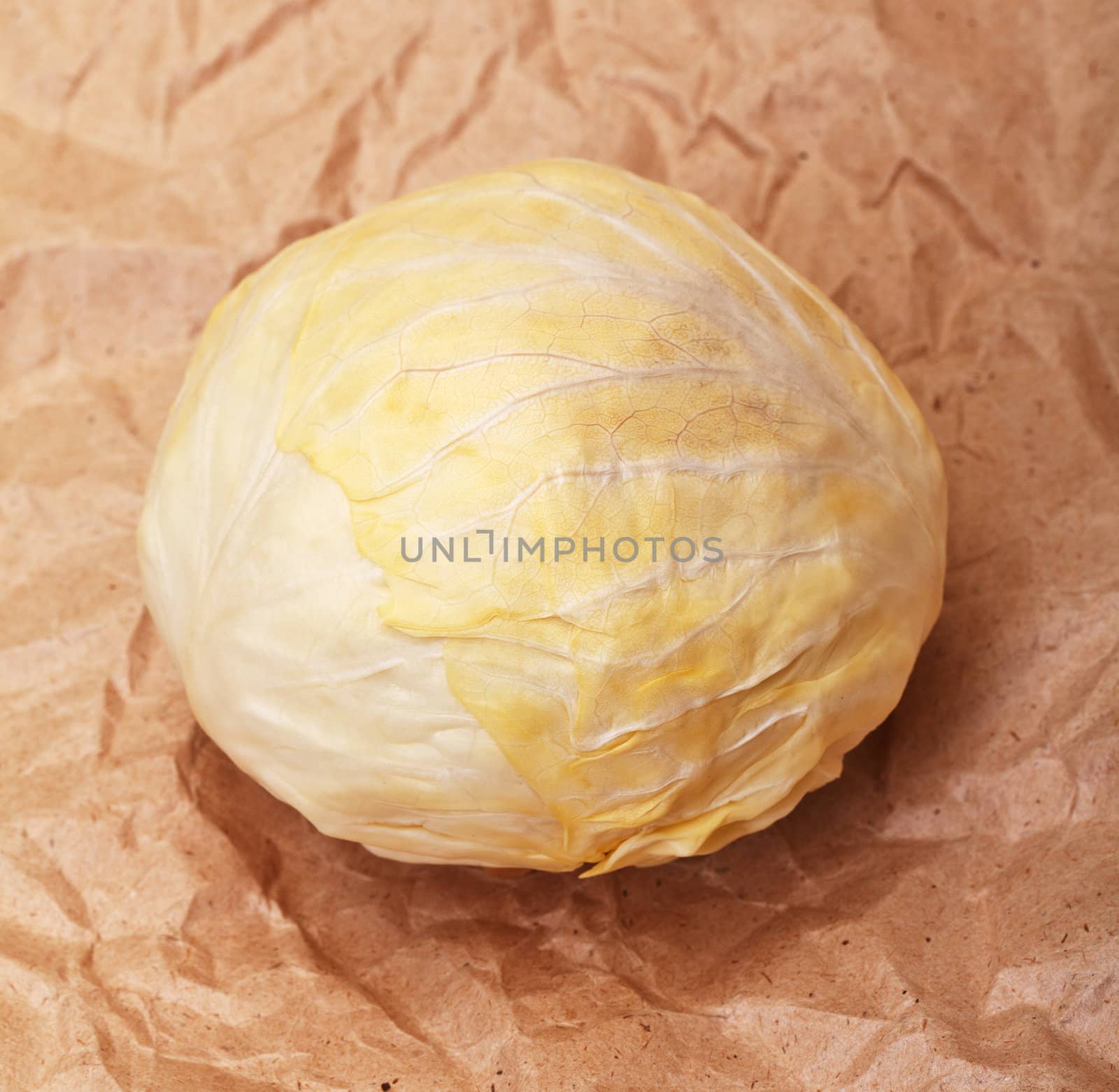 cabbage on brown crumpled recycled paper