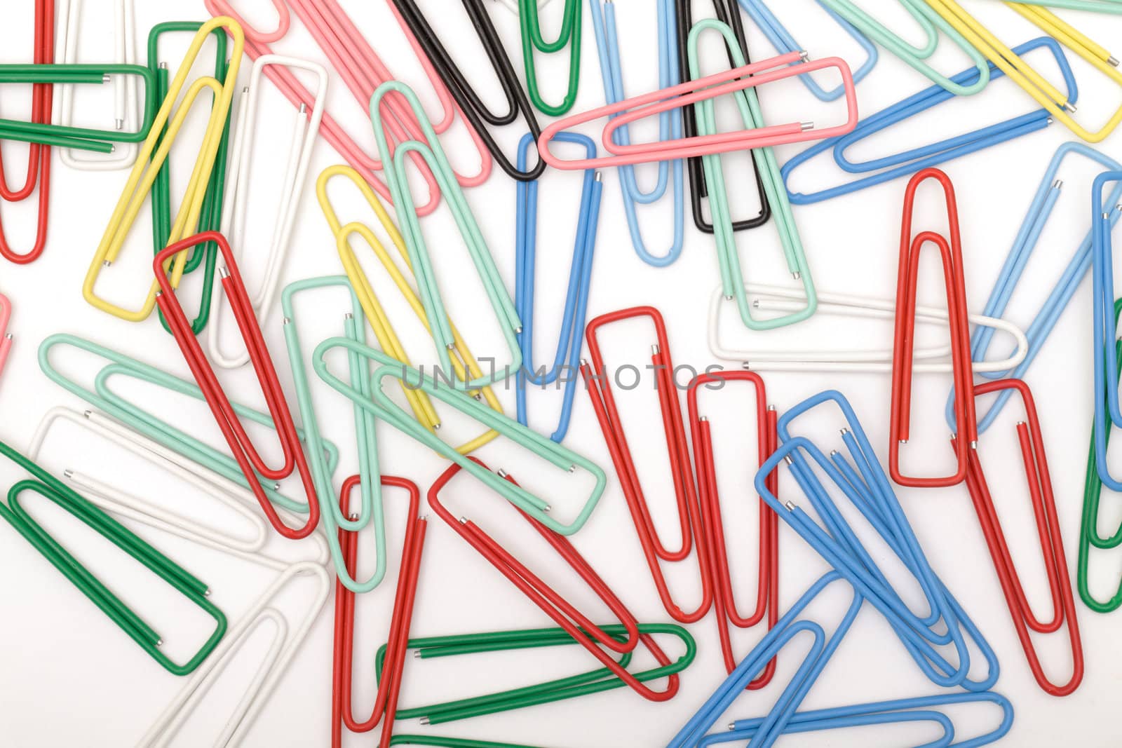 Colorful paper clips  on white