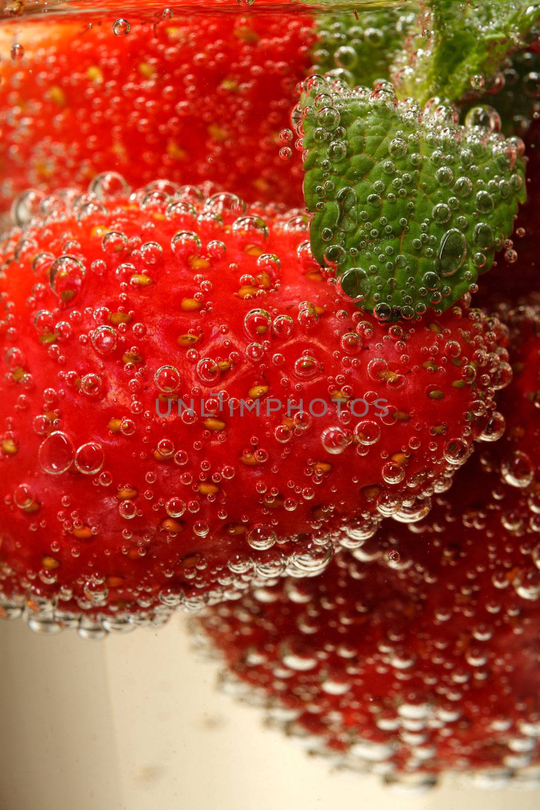 Glasses of sparkling wine and strawberry, macro
