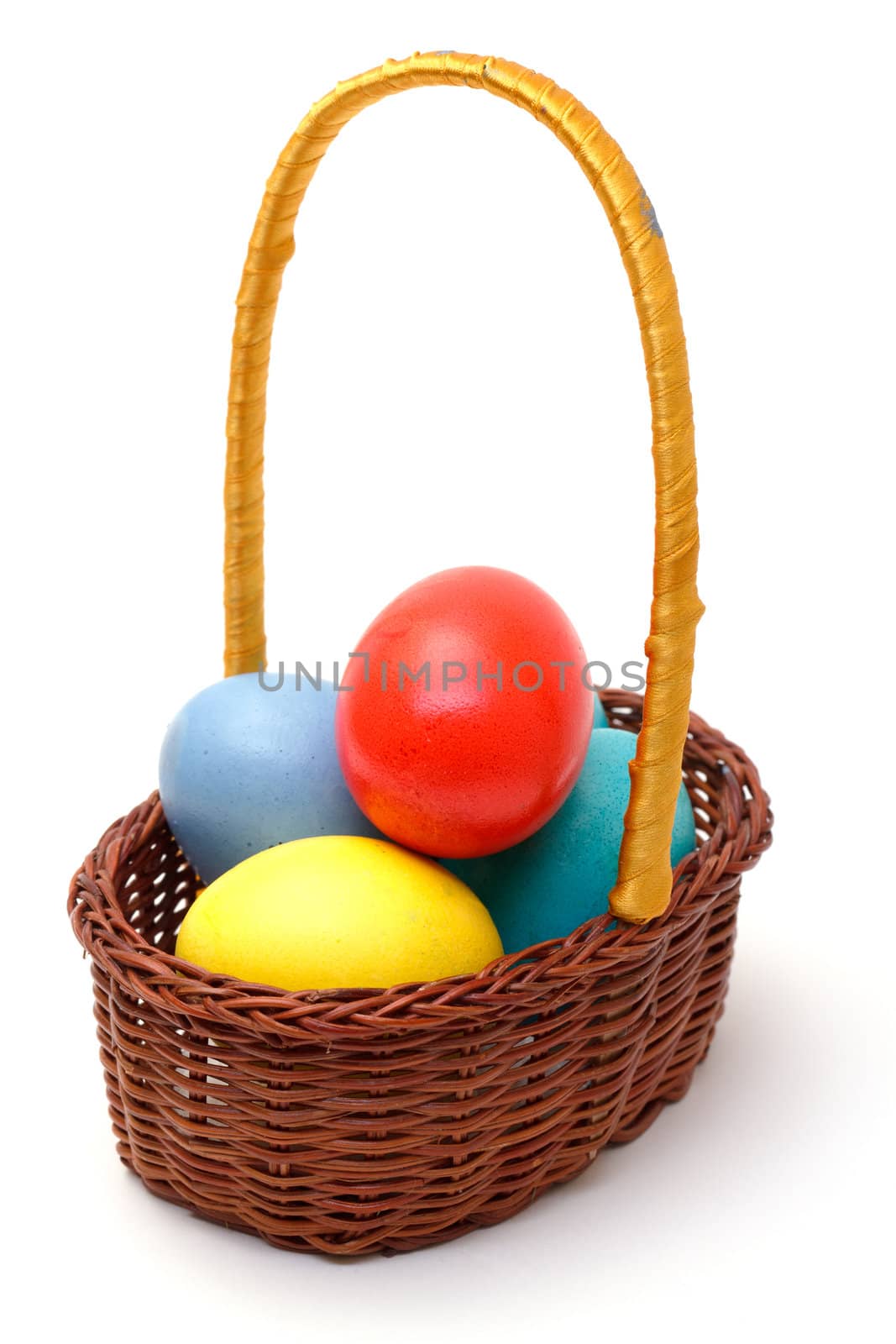easter eggs in basket on white
