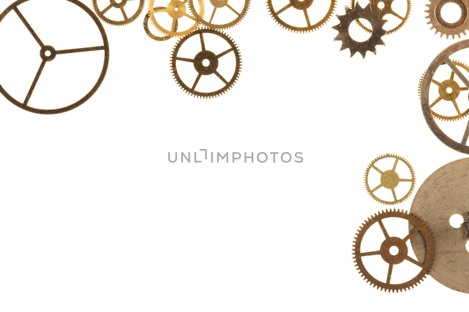 Cogs and other watch parts isolated on white background with copy space.