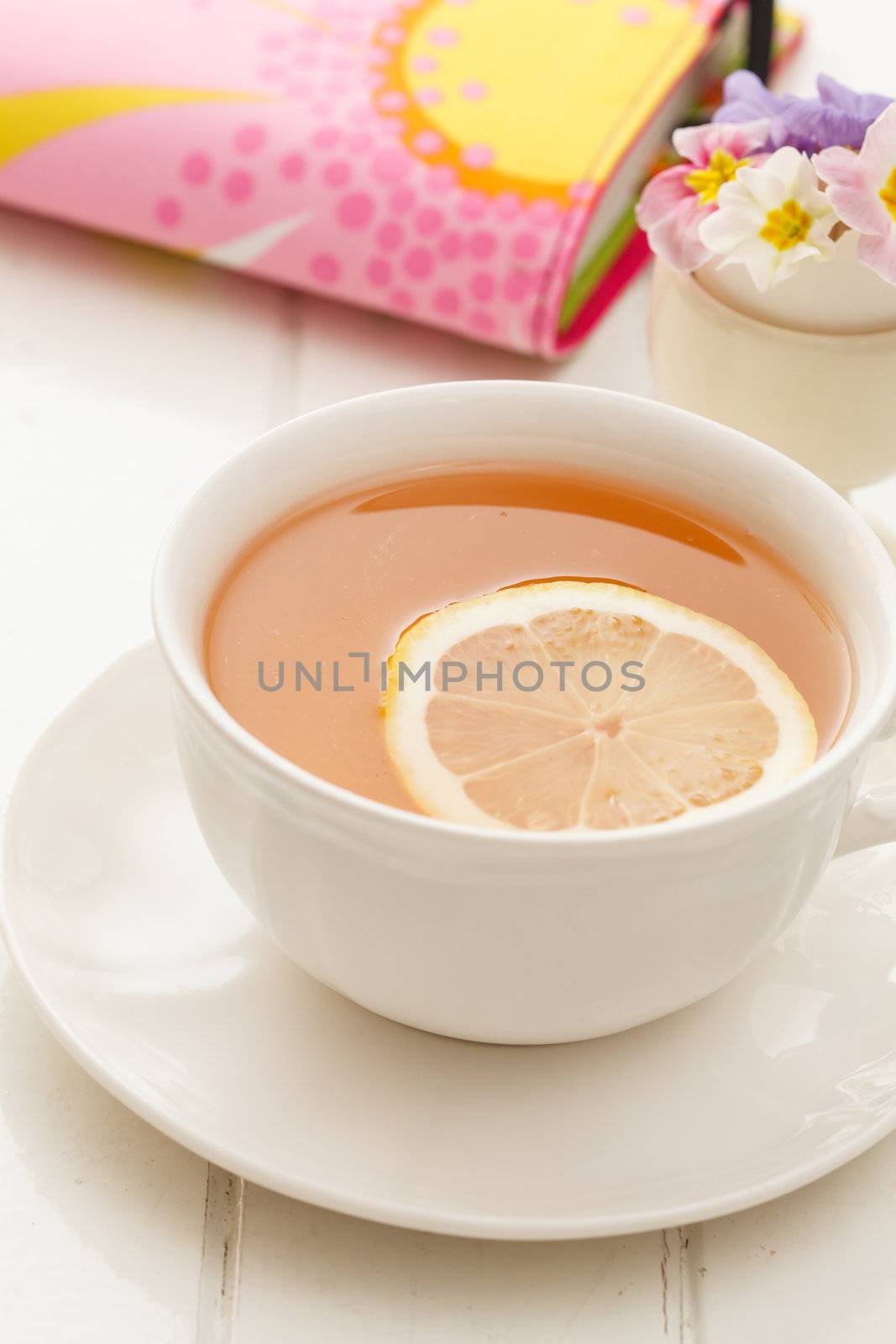 cup of tea with lemon by shebeko