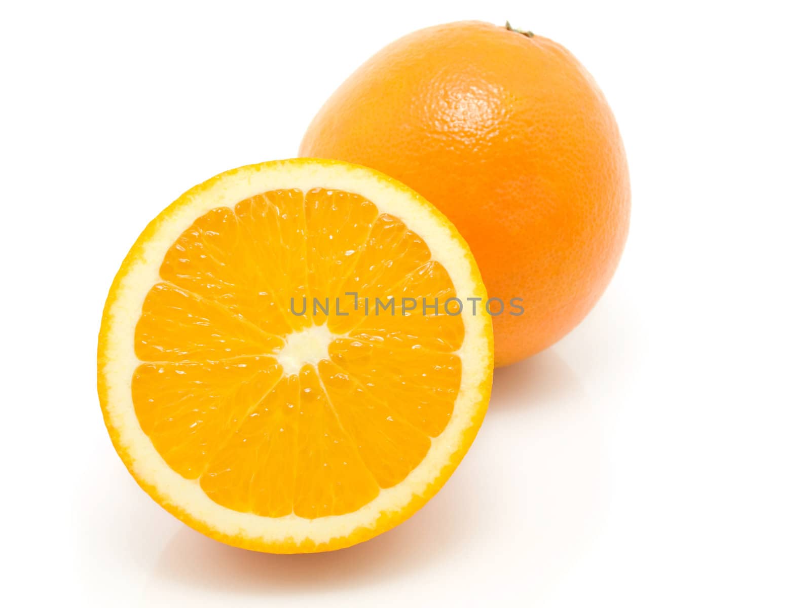 Ripe orange fruits isolated on white background  by motorolka