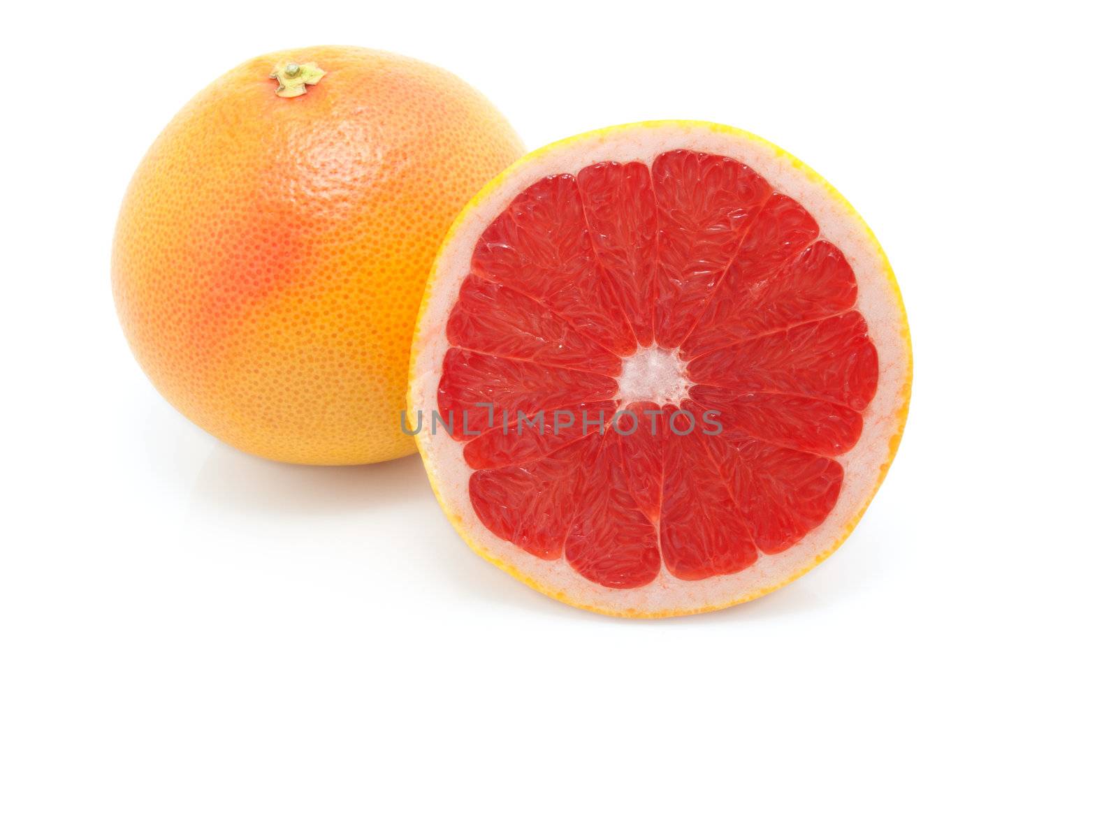 grapefruit on white background  by motorolka