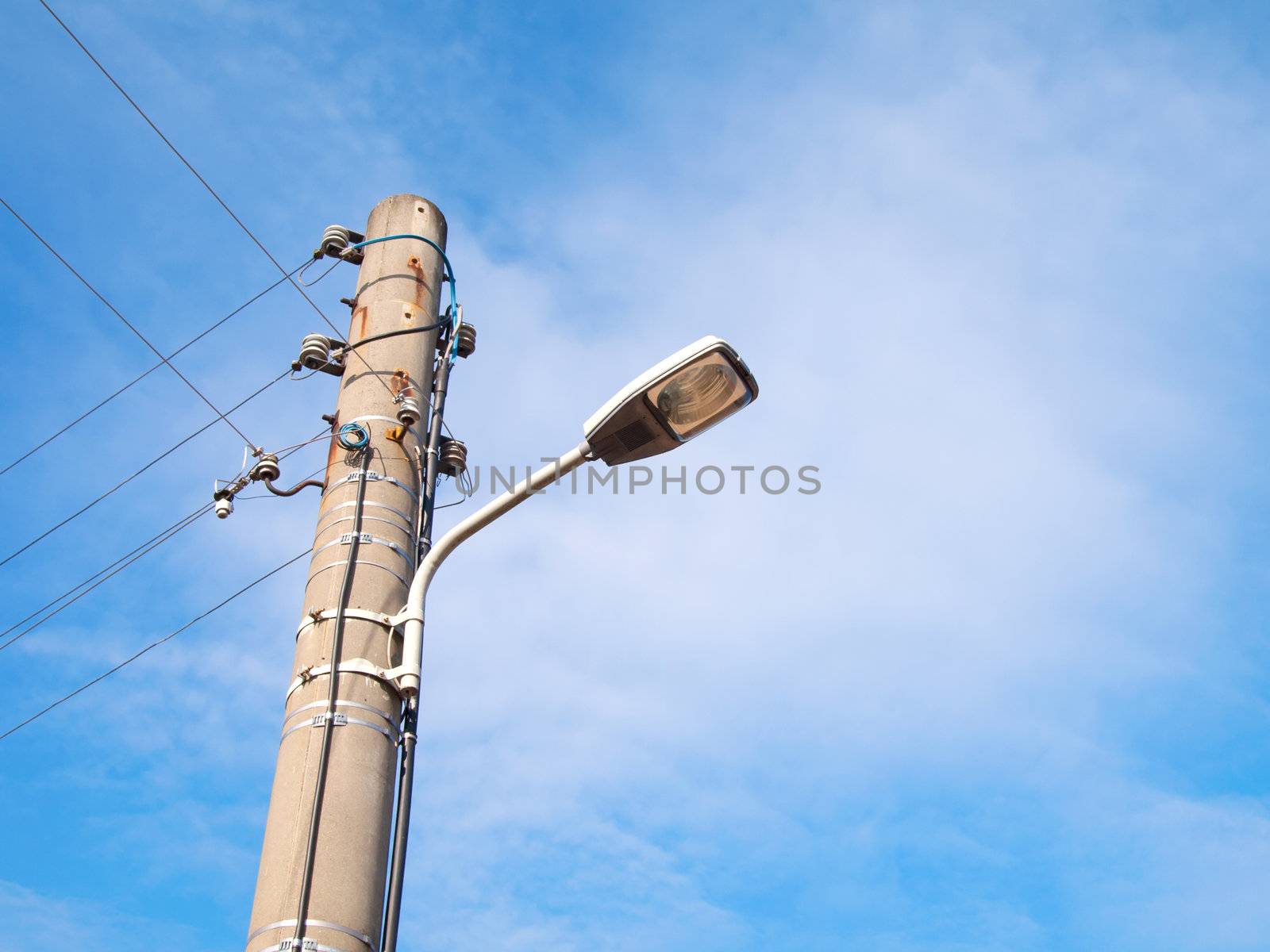 street-lamp on blue sky background  by motorolka