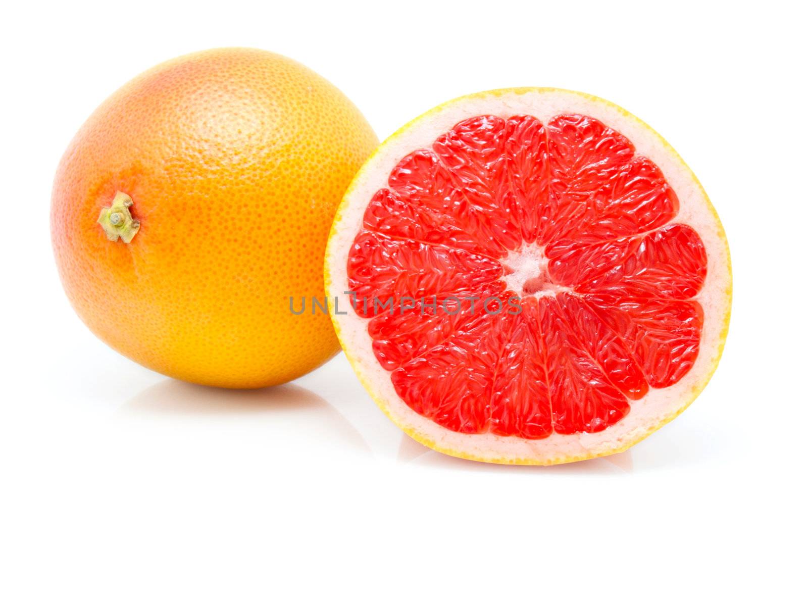 grapefruit on white background by motorolka