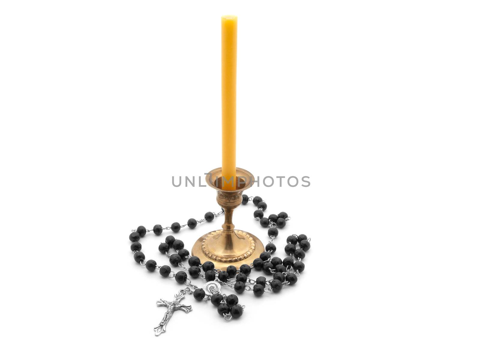 candle in bronze candlestick, rosary  on white background  by motorolka