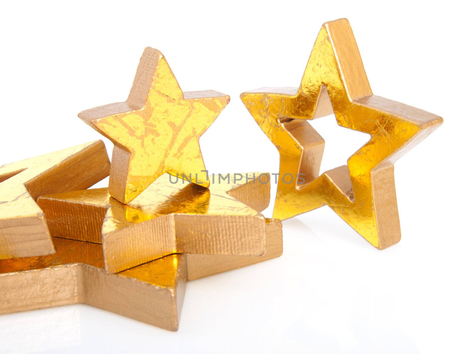 Golden Christmas stars, isolated on white background 