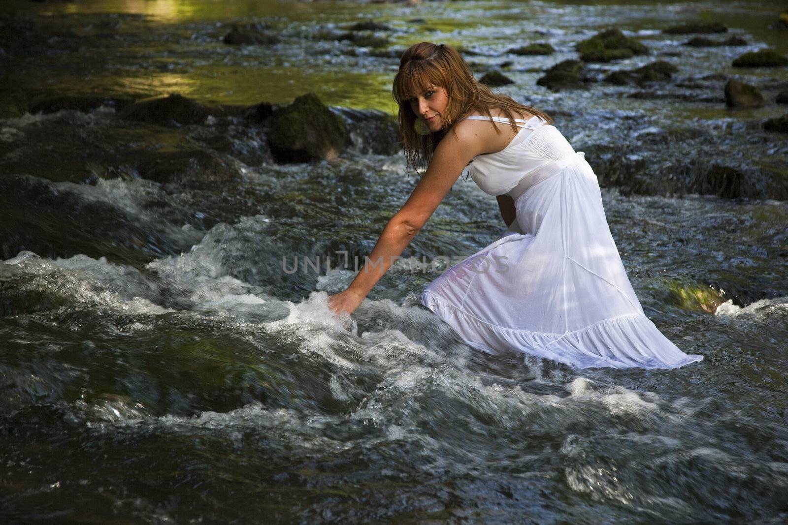 Girls With White Wet Dress Walking Cross The Stream