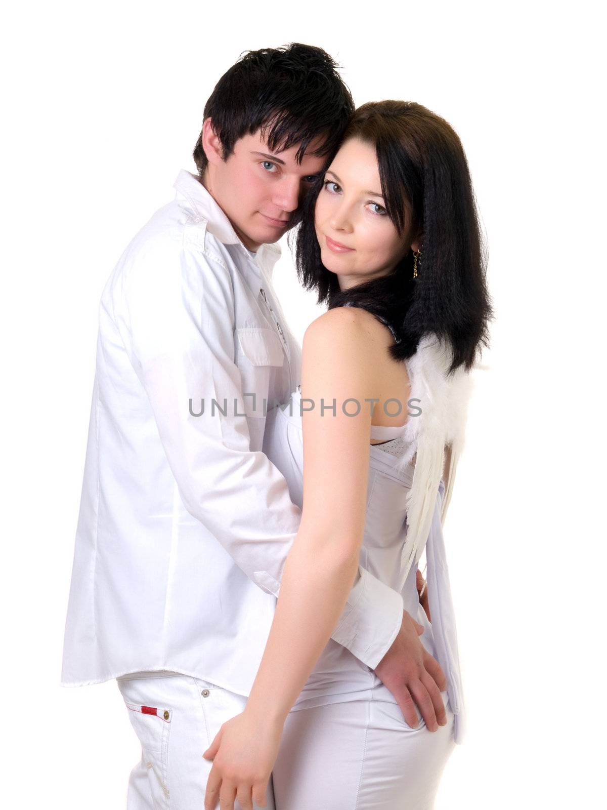 Portrait of a young handsome couple. Young man embraces woman. 